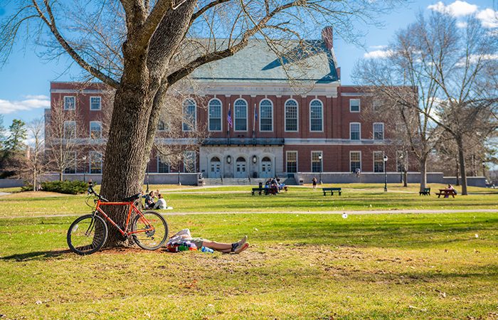 photo of the front of Fogler Library with students outside on the mall